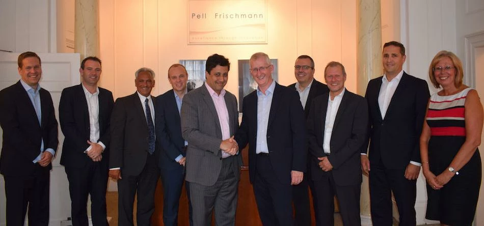 Tushar Prabu (left) welcomes Paul Marshall (right) into the Pell Frischmann group, accompanied by r