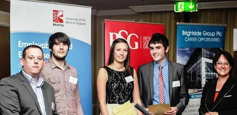 Jess (centre) receiving her award, along with (from left) Alan Bailey, chief executive of award spon