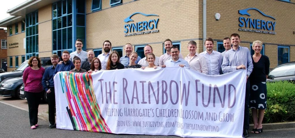 Ramping up support for The Rainbow Fund: Paul Parkinson, 4th from left back row and the Synergy Auto