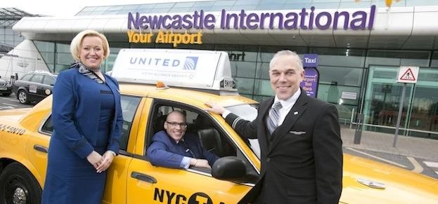United Airlines flight attendants James Kelly and Lulu Riedstra greet Leon McQuaid, Newcastle Intern