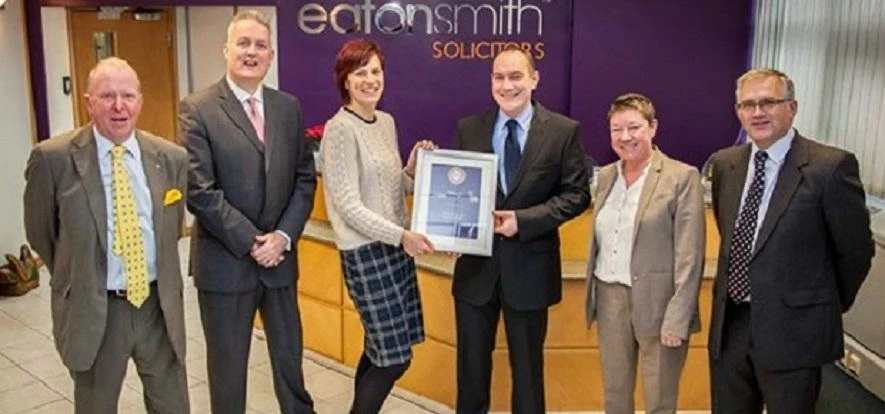 J. G. Harrison & Sons collecting the prize at Eaton Smith's offices