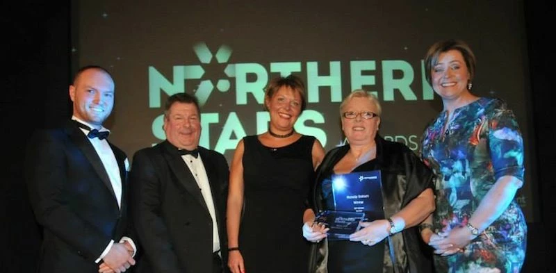 Michelle being presented with her award by host Carol Malia