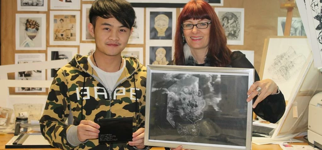 Abbey College Manchester student Zhenyu Yuan is pictured with his winning image and receiving his pr