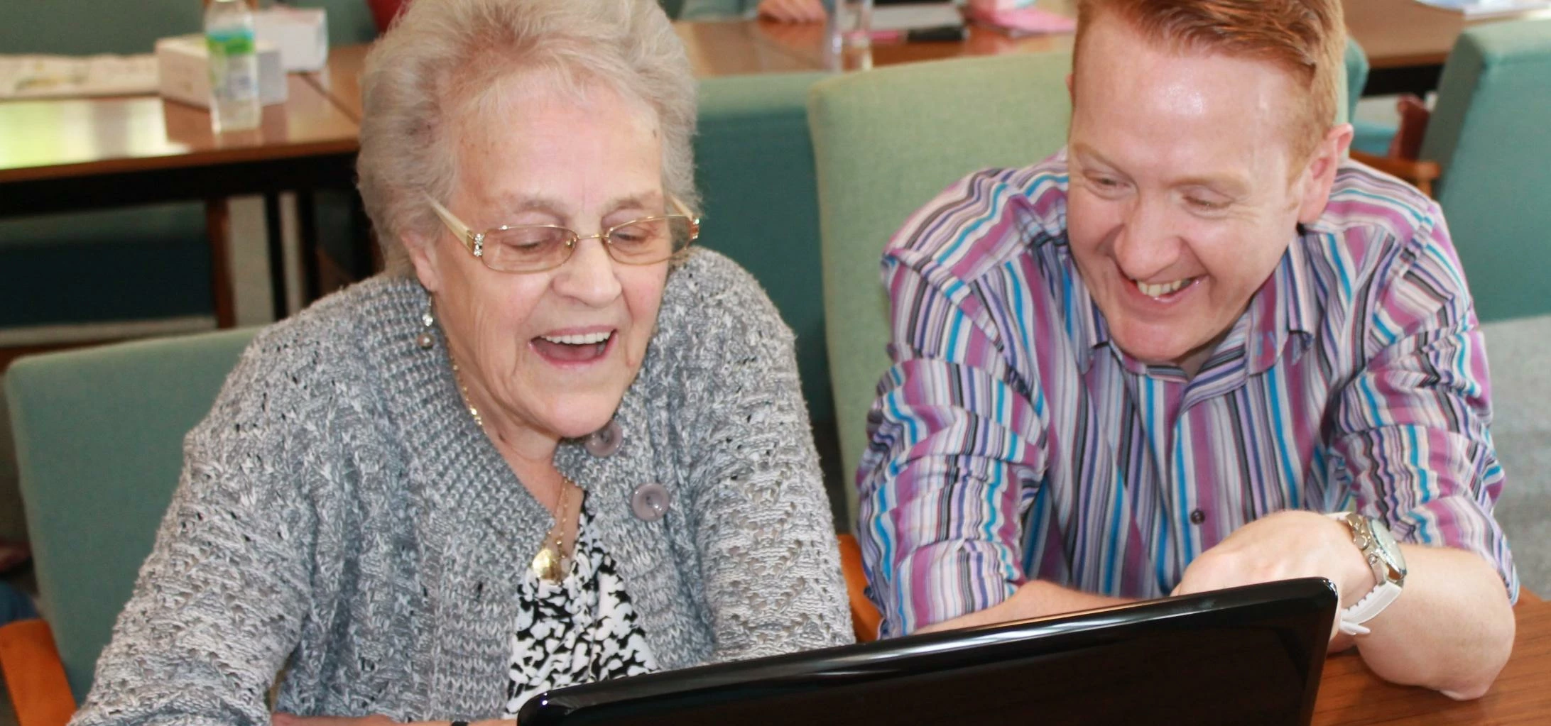 Salix Homes tenant Irene Bolton surfs the internet with Greg Muir, community involvement and new ini