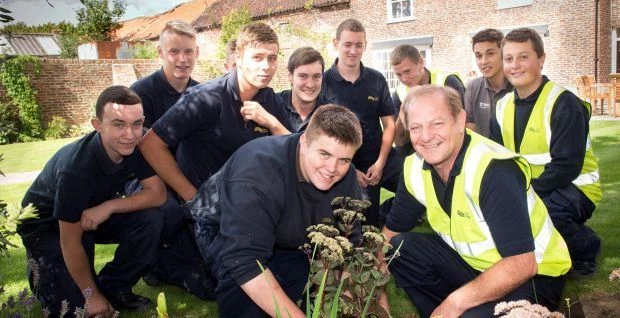 Front l-r: Coast & Country horticultural apprentice Liam Duke and Redcar MP Ian Swales with other Co