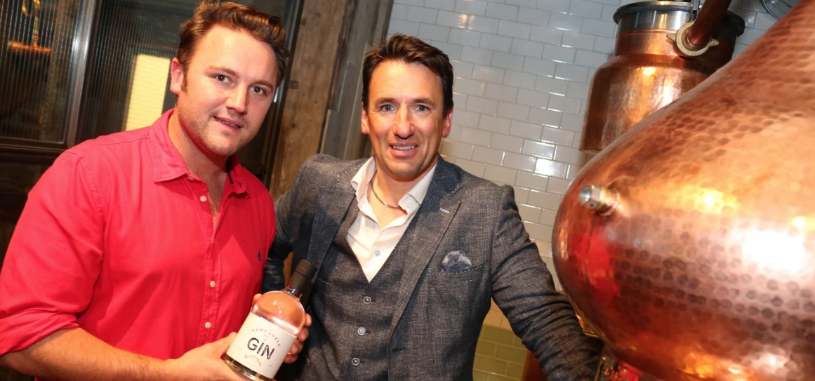 Vaulkhard Group’s directors Harry and Ollie Vaulkhard next to the 8ft gin still situated on the grou
