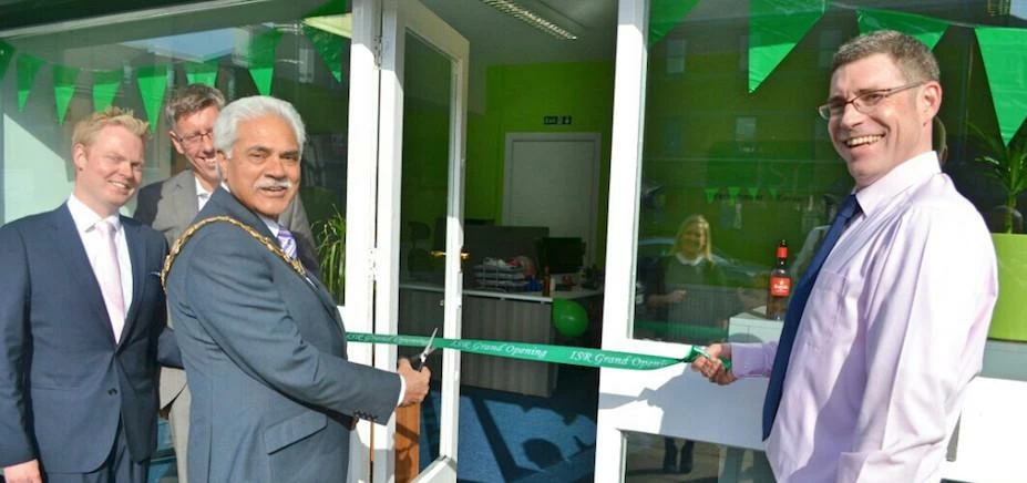 Mayor of Trafford Ejaz Malik​ and Managing Director Iain Brassell as they cut the ribbon to official