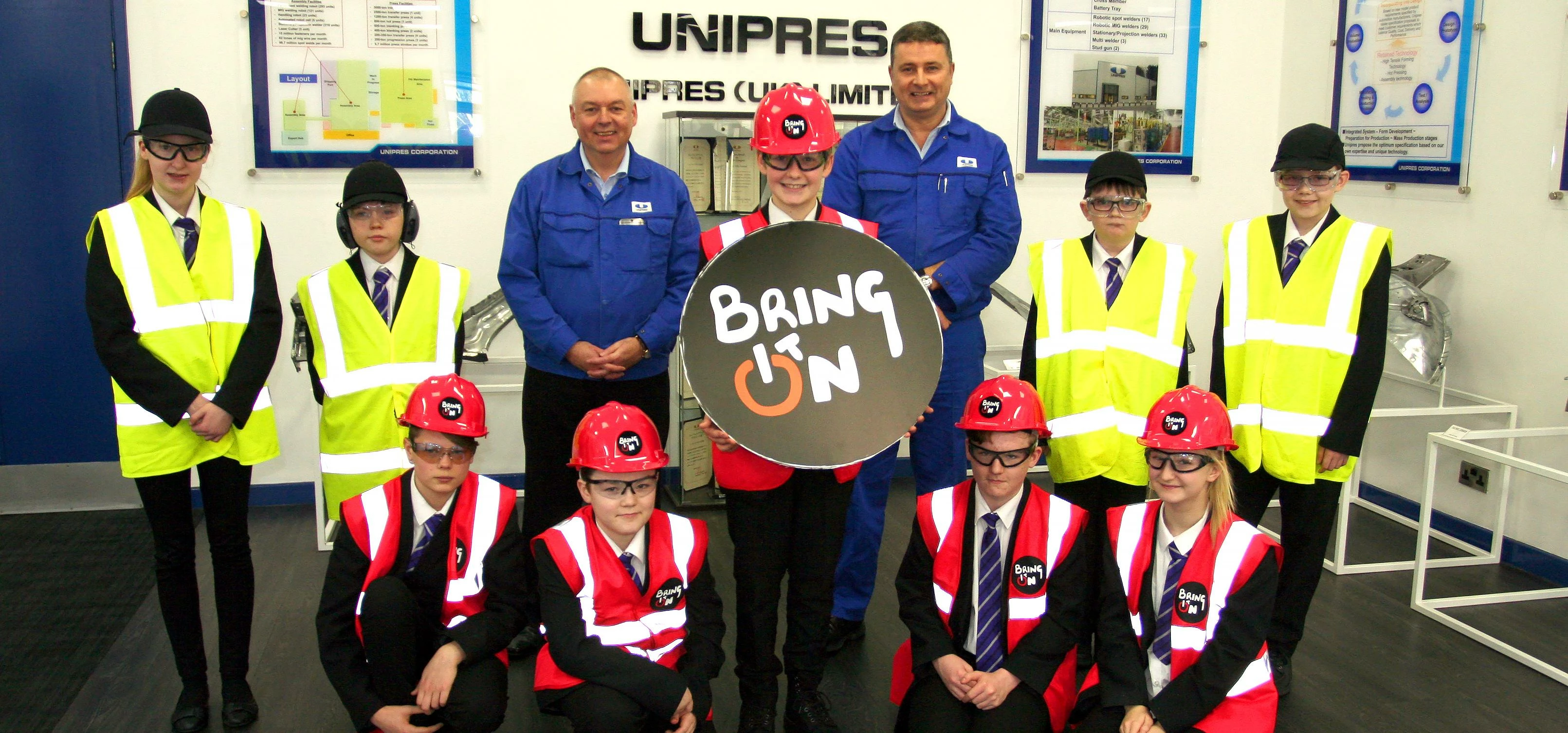 Students from Castle View Academy, Sunderland with Unipres (UK) Ltd operations director John Cruddac