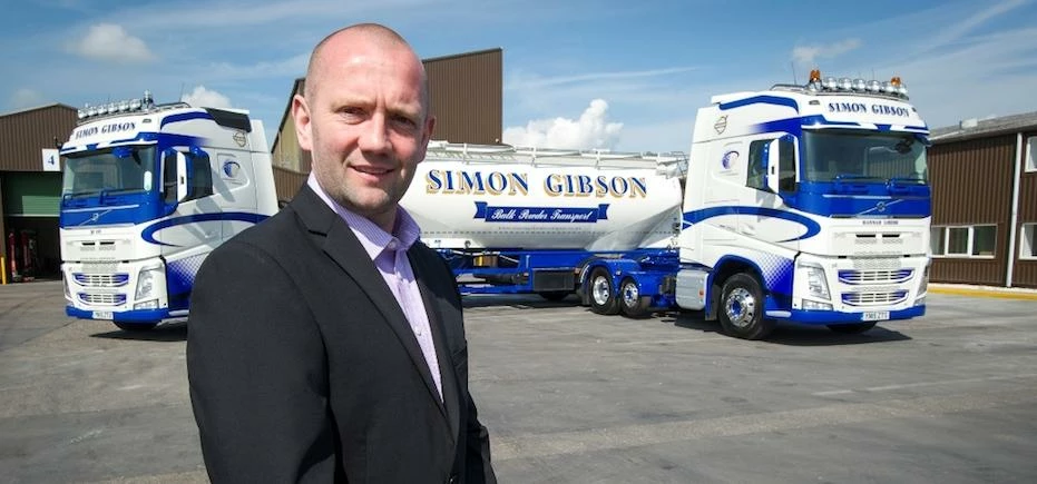 Simon Gibson with the firm's transport fleet at the Goole headquarters. 