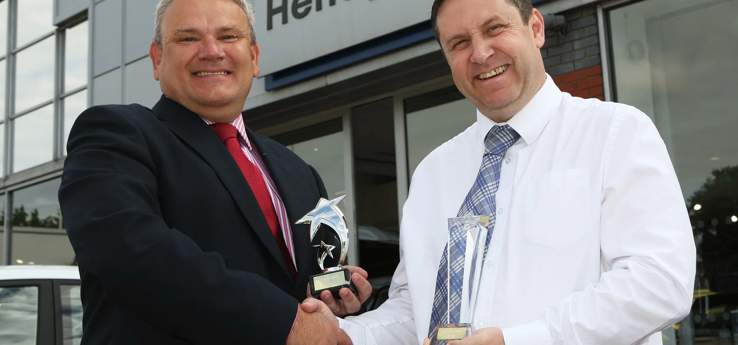 Ford district manager Andy Lee presents Stuart Layton with his awards