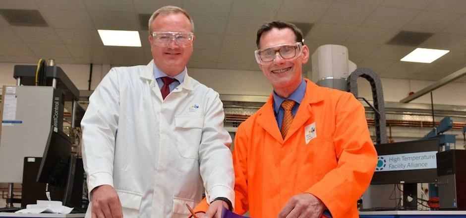 Greg Willetts (left) and Andrew Sherry cut the ribbon to open the new lab.