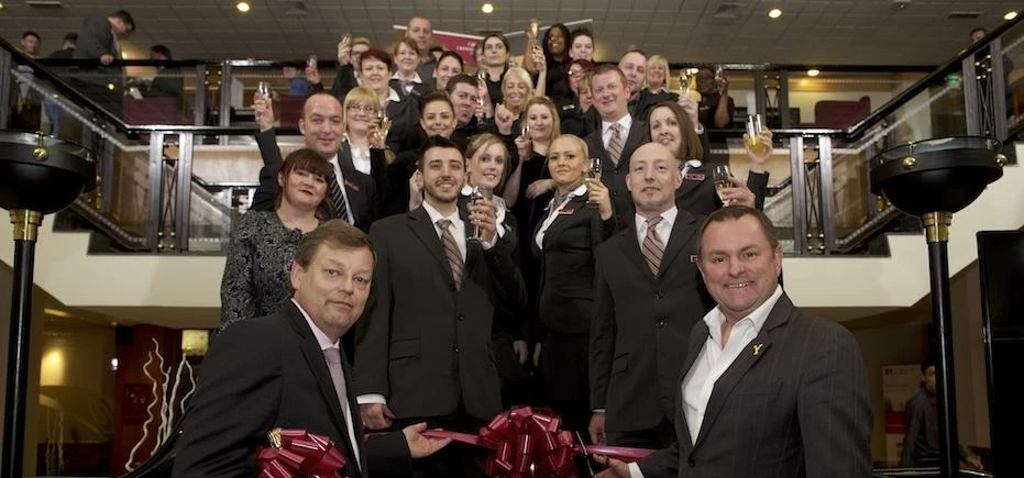 Crowne Plaza Leeds general manager Marco Frik and Sir Gary Verity join hotel staff in officially re