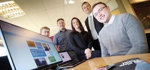 Peter Taylor of UK Steel Enterprise (standing right) with some of the growing Itchyrobot team – (fro