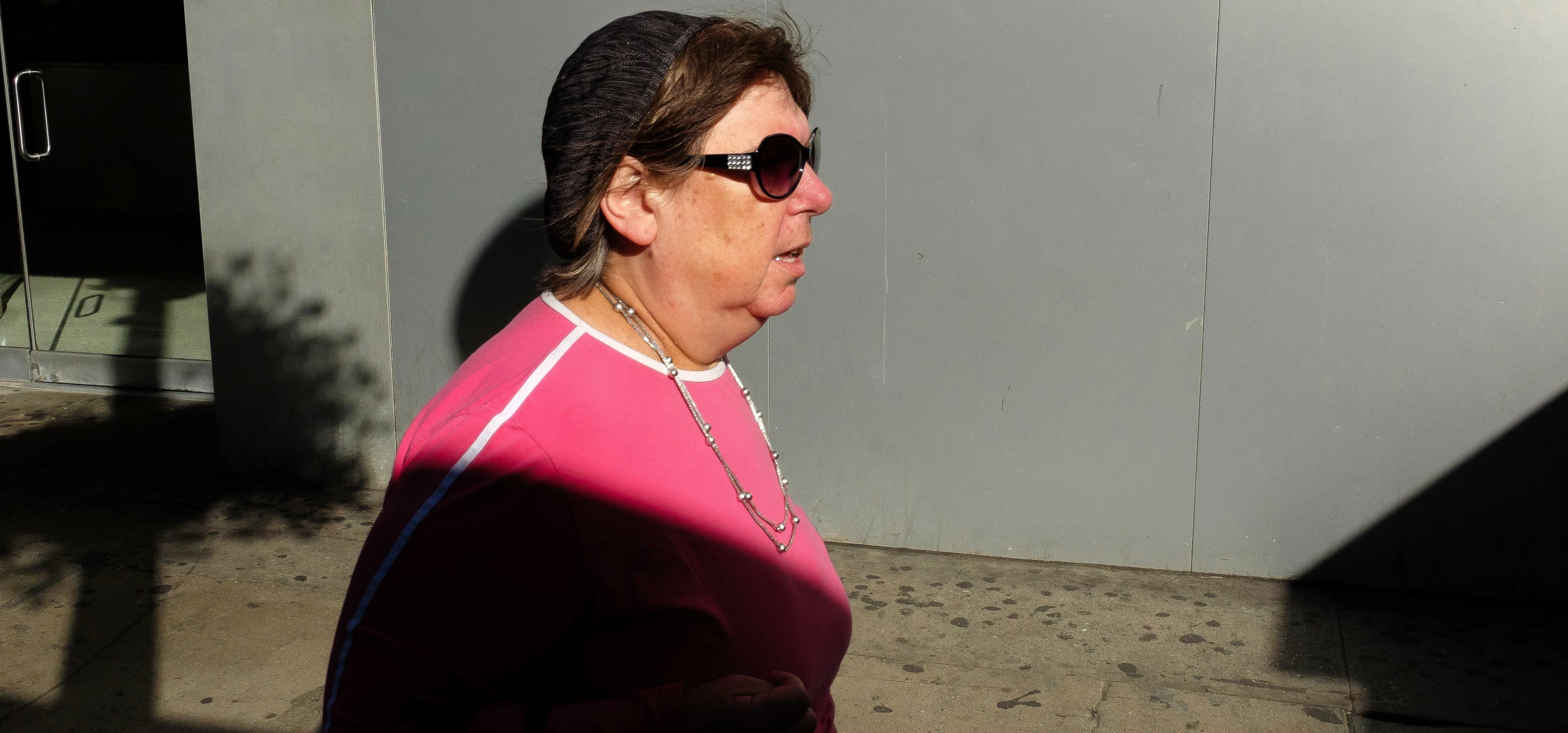 New York City Street Scenes - Woman in Pink Shirt Walking on Sidewalk