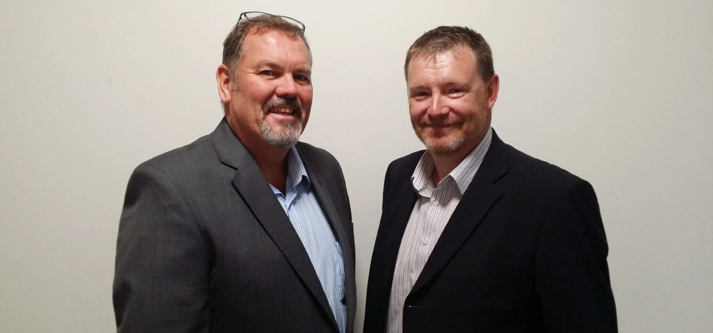 Chris Binge greets Troy McKee, new purchasing manager at Fairway Foodservice.