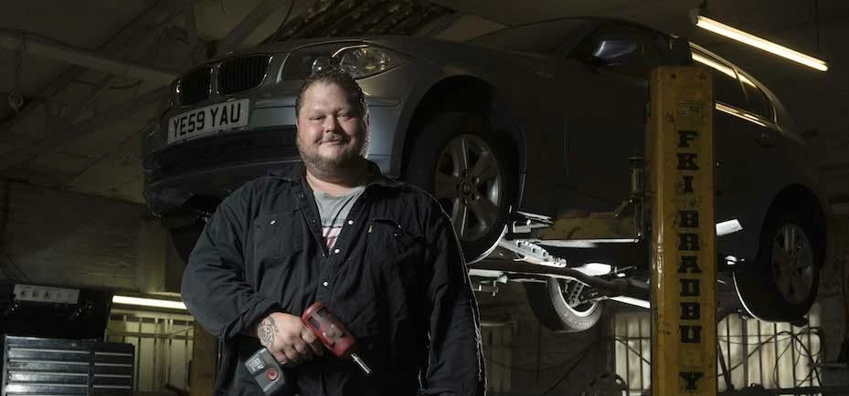 Car enthusiast, Jed Mitchell, buys garage with funding from Yorkshire Bank.