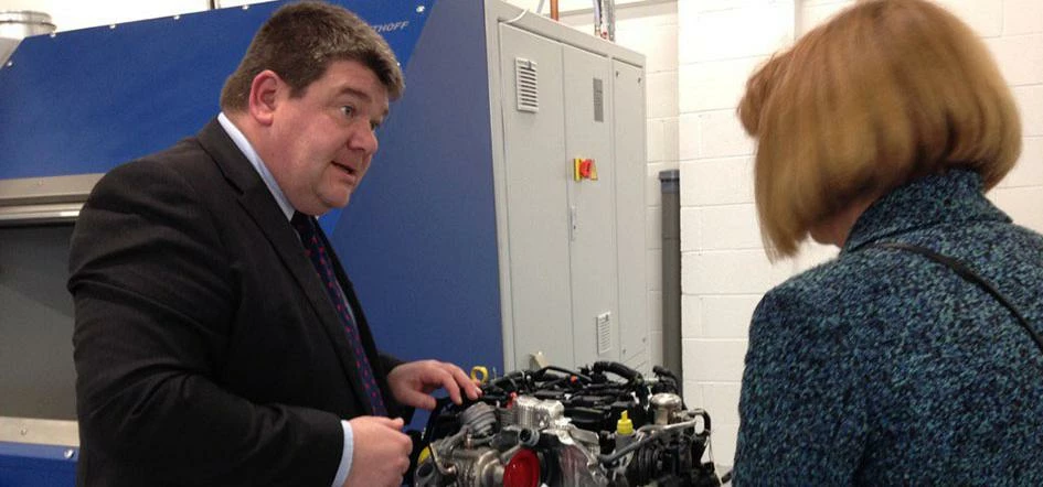 Professor Carl Perrin presents one of AME's R&D projects to Dr Ruth McKernan of Innovate UK 
