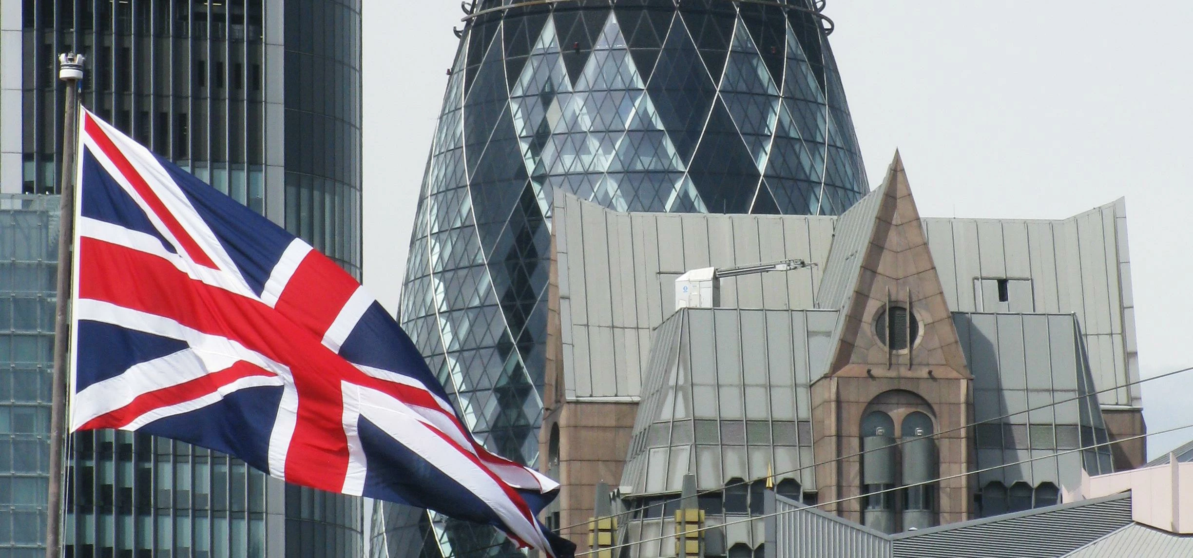 British flag and the Gherkin, London