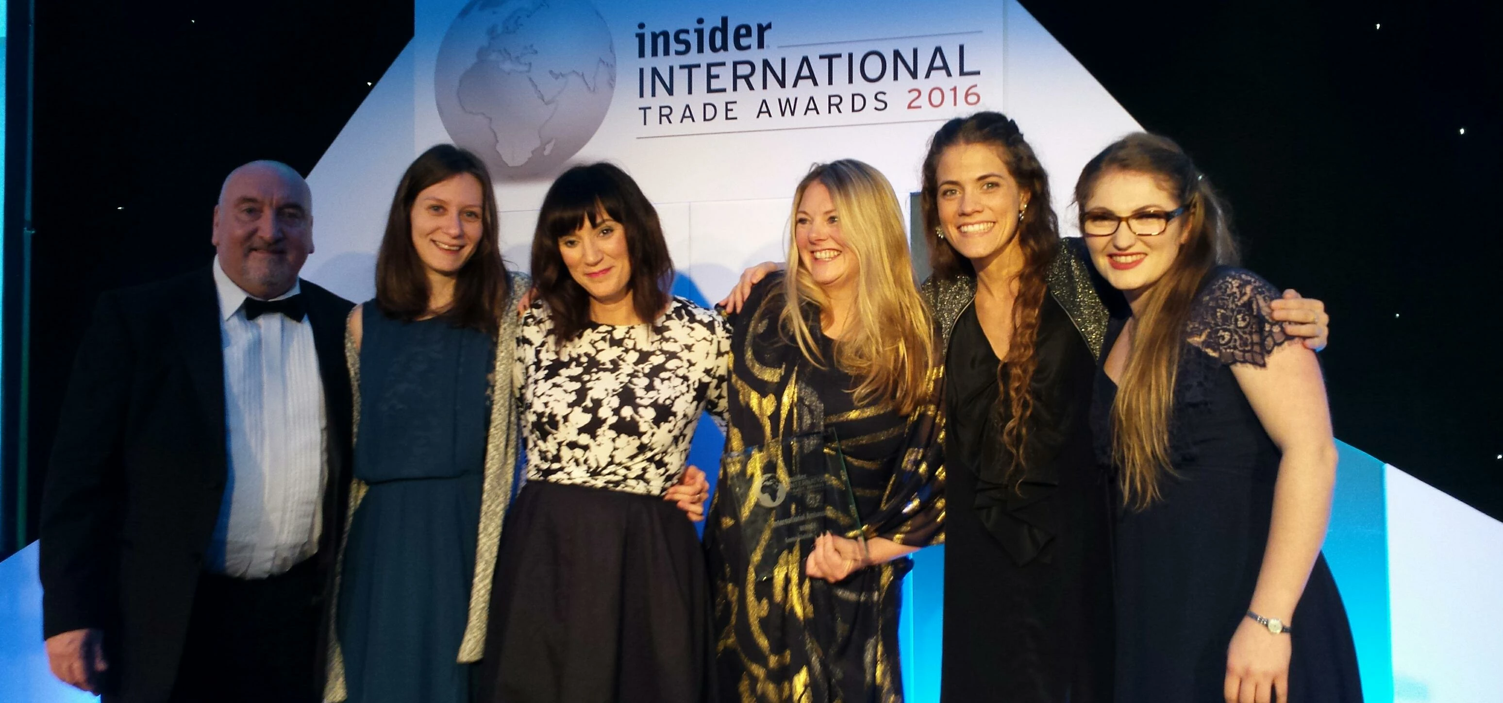 Emma is pictured centre (holding award) with members of the Vernacare marketing team