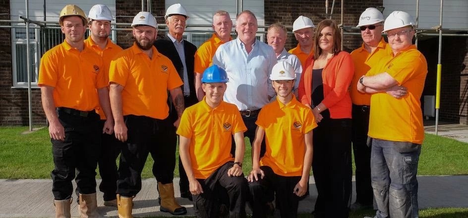 Peter Davison, owner of RPD Builders with apprentices.