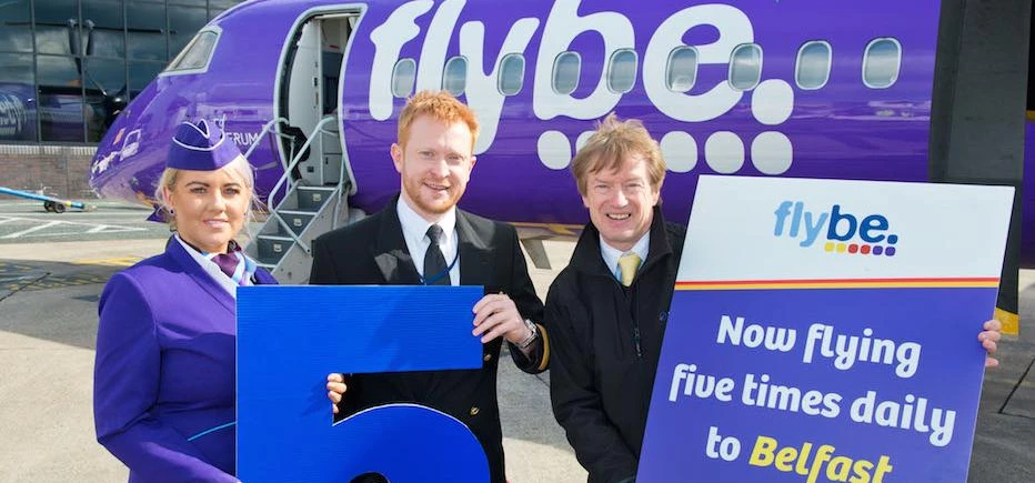 Tony Hallwood, right, with Flybe’s crew to celebrate the fifth rotation from Leeds Bradford Airport.