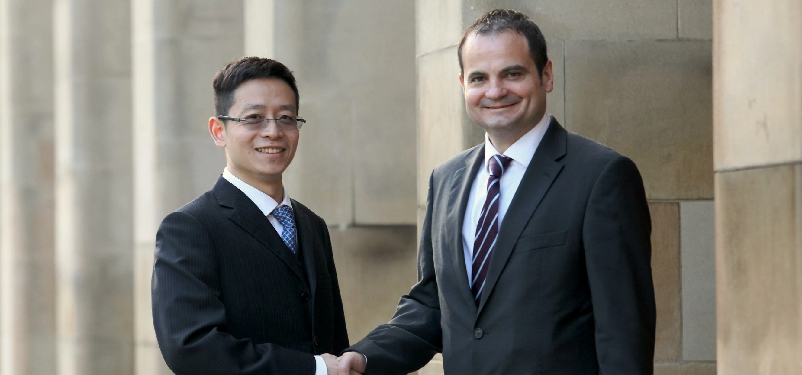 Jinstar's Steve Yang (left) with Michael Purcell of Manchester & Cheshire Construction
