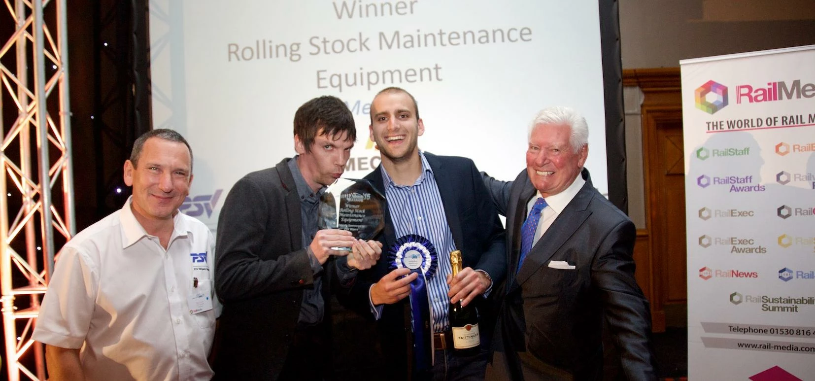 Mechan’s Lee Pitts and Adam Elliott (centre left and right) receive the firm’s Railtex Award from sp