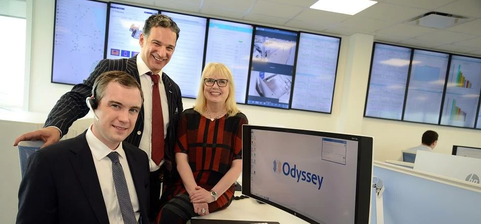 James Wharton MP (seated) with Mike Odysseas, Managing Director of Odyssey Systems, and Christine Gi