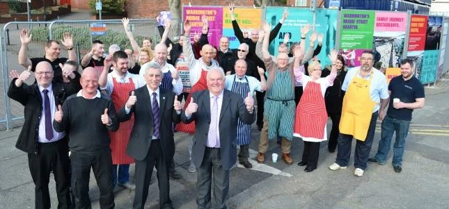 Councillors Terry O’Neill and Mike Hannon celebrate progress along with Warrington market traders