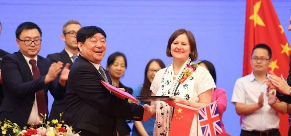 Mr Wang of Sichuan Guodong Construction Group and Councillor Julie Dore when the partnership was ann