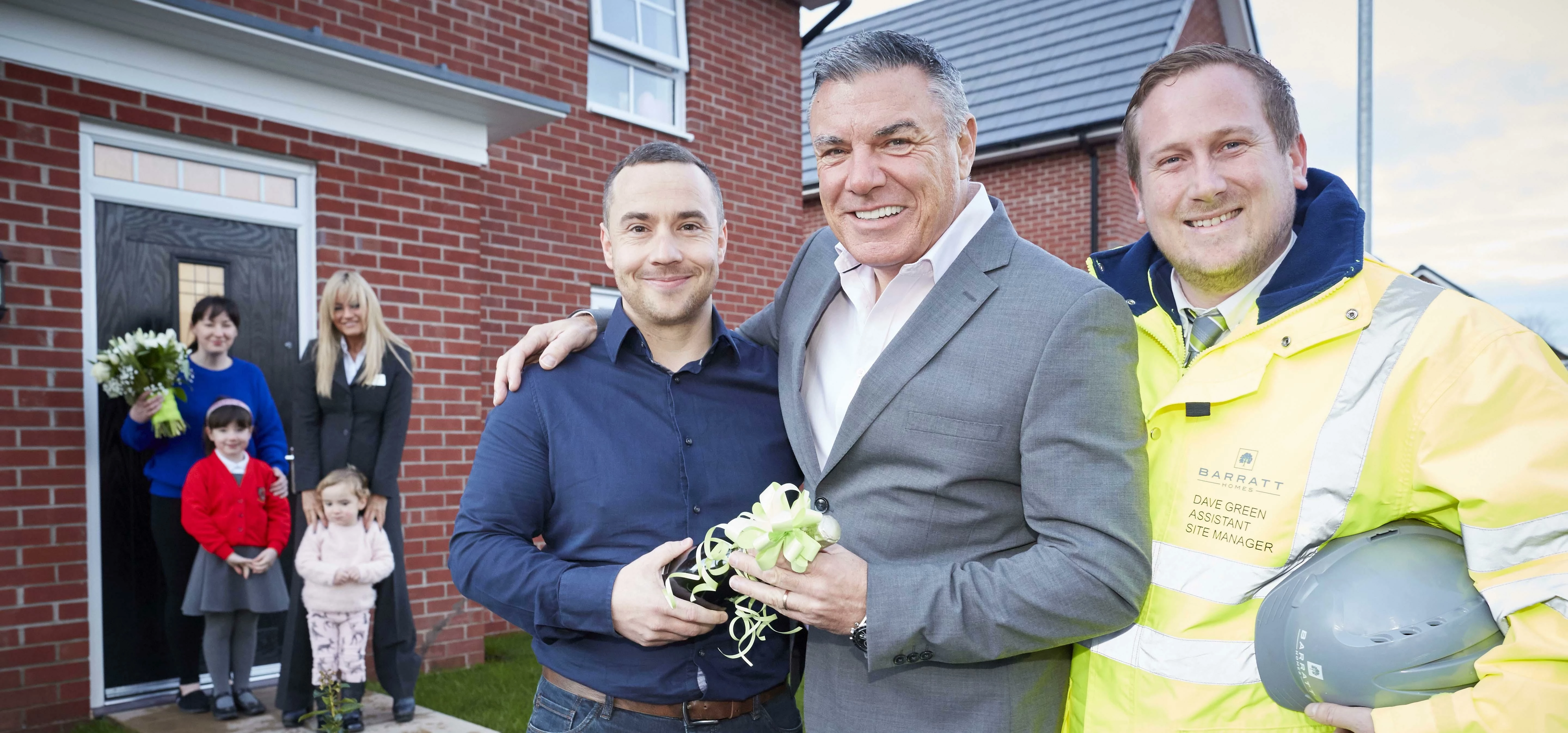 Neil Goodwin, MD of Barratt Manchester celebrates the final completion with residents Mark and Barba