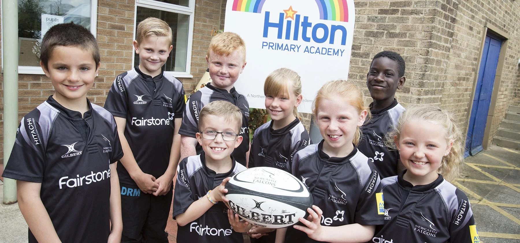 Children from Hilton Academy sporting their new rugby kit thanks to donation from Fairstone Financia