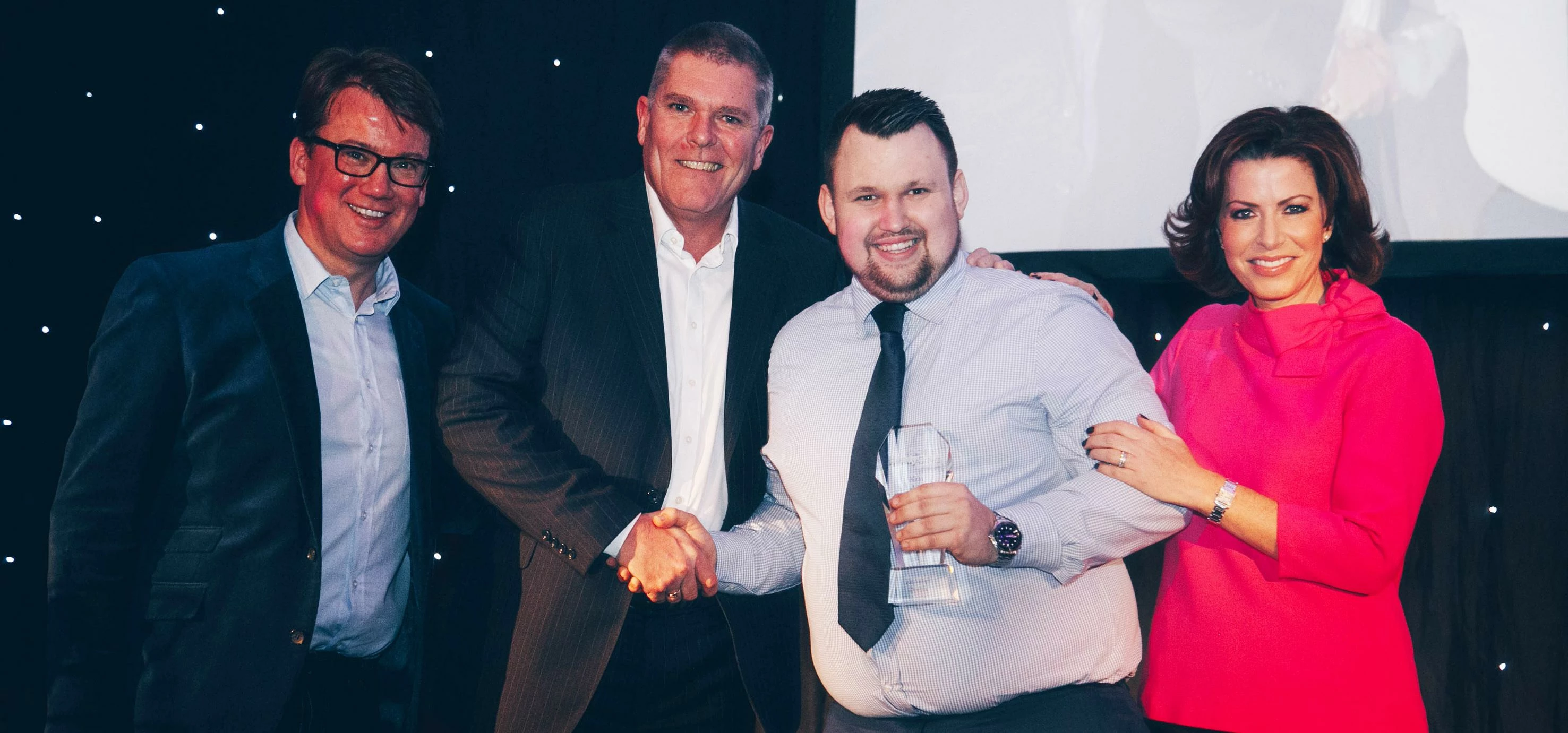 Left to right Hendy new car sales director Paul Murrells, Mark Hawkins from Renault, Tom Mann and TV