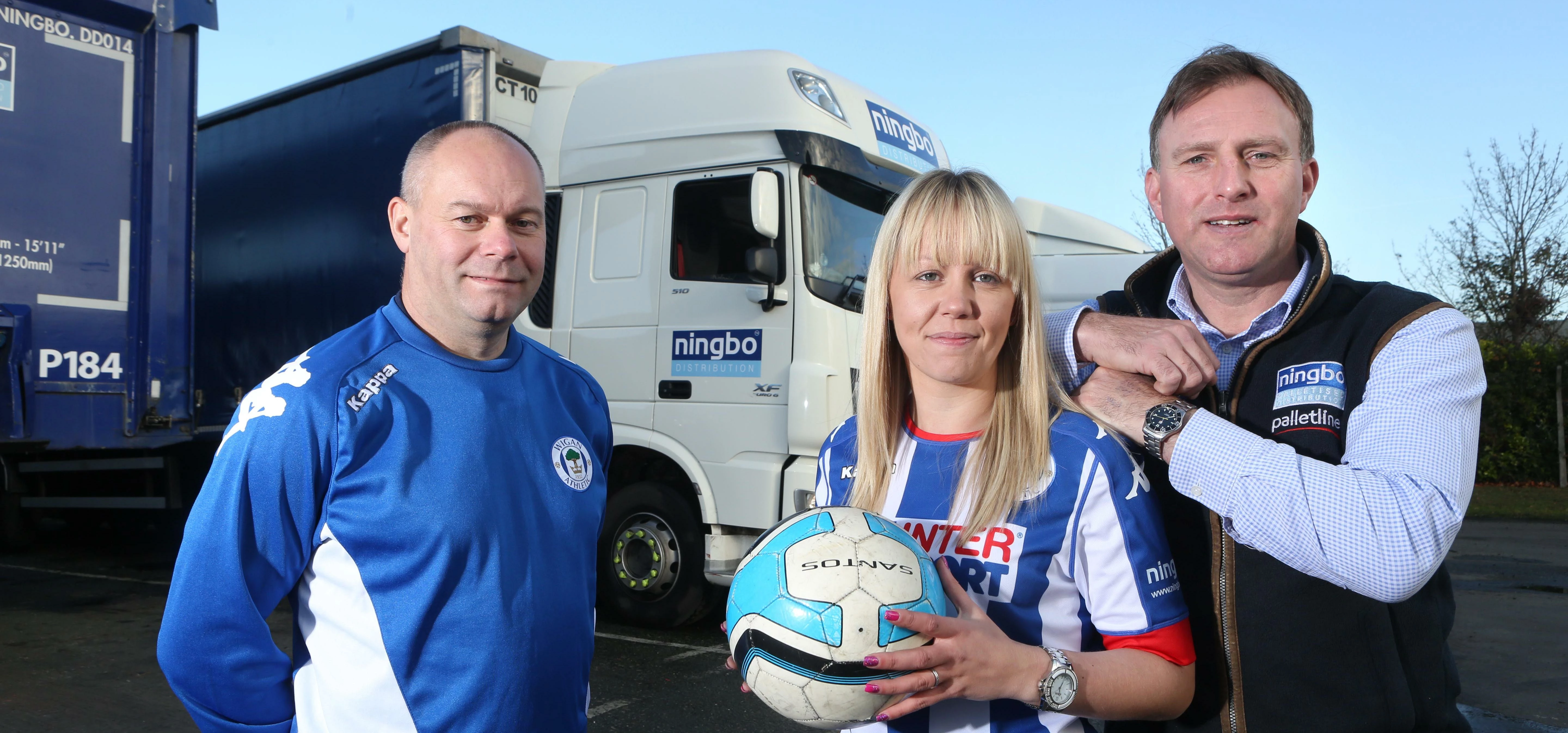Wigan Athletic Ladies FC player Michelle Hunt is pictured with coach Derek Booth (blue top) and Chri