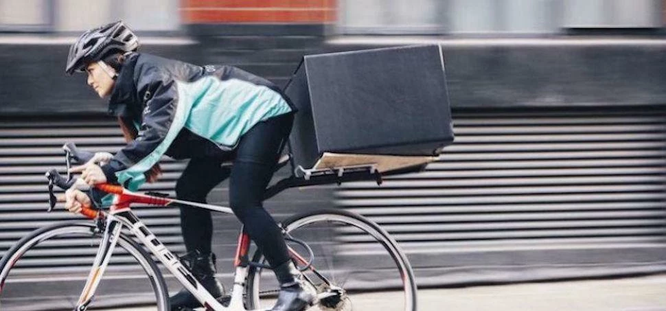 A Deliveroo rider as the firm launches its corporate service this week.