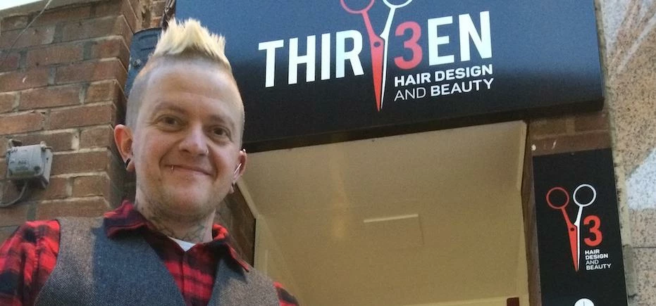 Andy McClintock, owner, at the entrance to the salon.