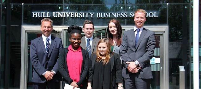 director and general manager Rix Petroleum, Duncan Lambert, with students Callum Jones, Sarah Estill