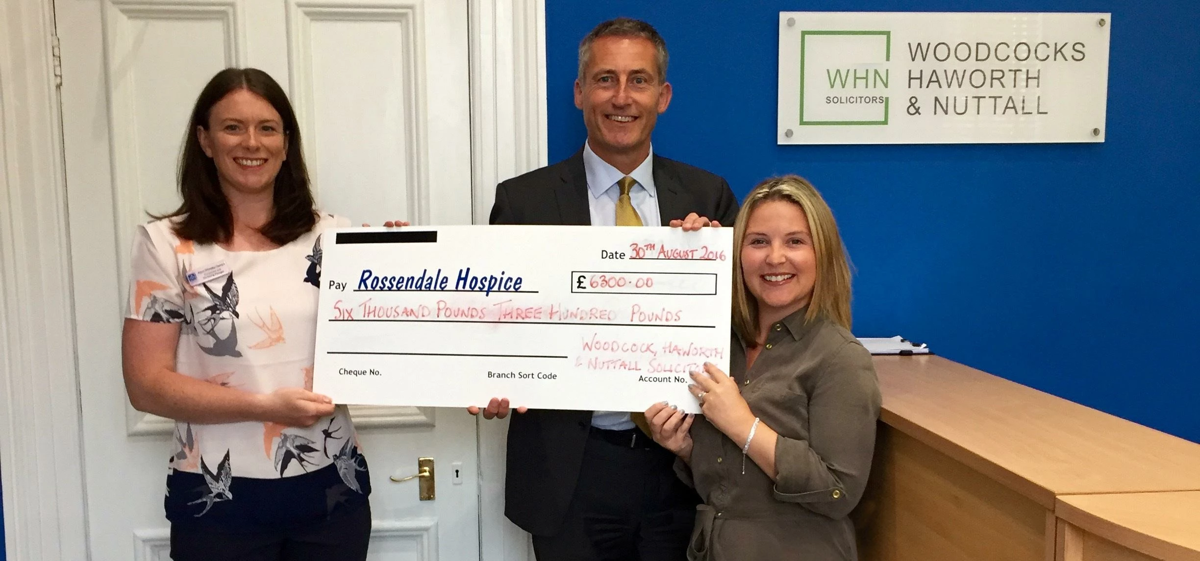 LR Alison Whittaker-Stuart from Rossendale Hospice, David McCann and Stacey McCann of WHN Solicitors