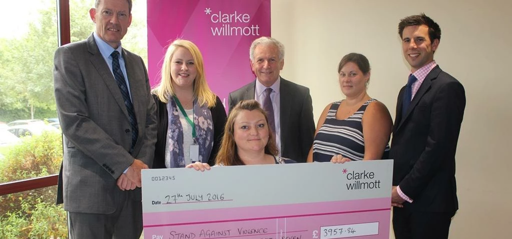 Clarke Willmott presenting one of the cheques
