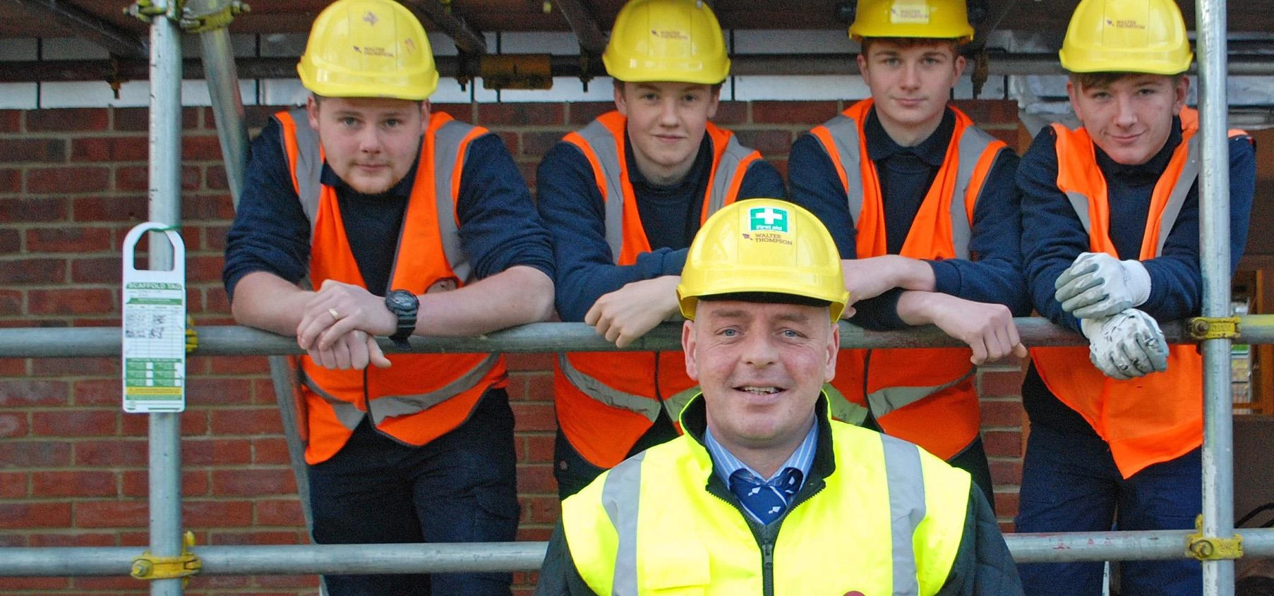WELCOME ... Site manager Phillip Gallagher with Walter Thompson's four new apprentices