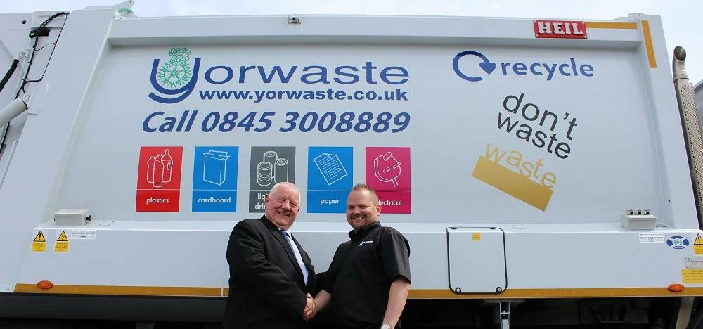 John Field (left) and Dave Clarke with one of the Yorwaste vehicles that have been fitted with the s