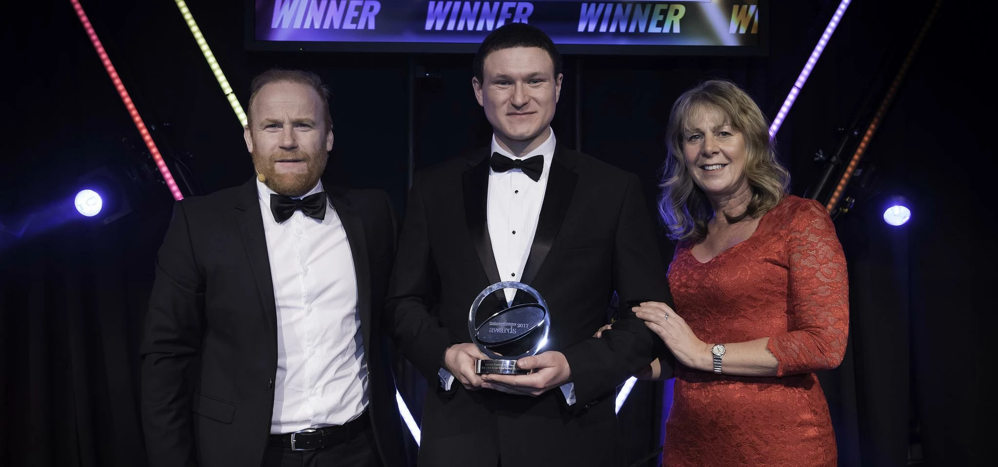 Robert (centre) with comedian Rory O'Hanlon and Gemma Harle, managing director of award sponsor Tene