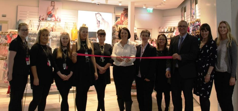 Airport staff with Accessorize employees at the new LJLA store