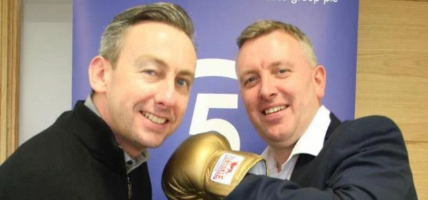 James Beattie (left) trades blows with Nick Smith of Ultimate Finance