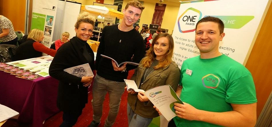 Neale Coleman, Acting Deputy Chief Executive at One Awards (right) with students at the admissions f