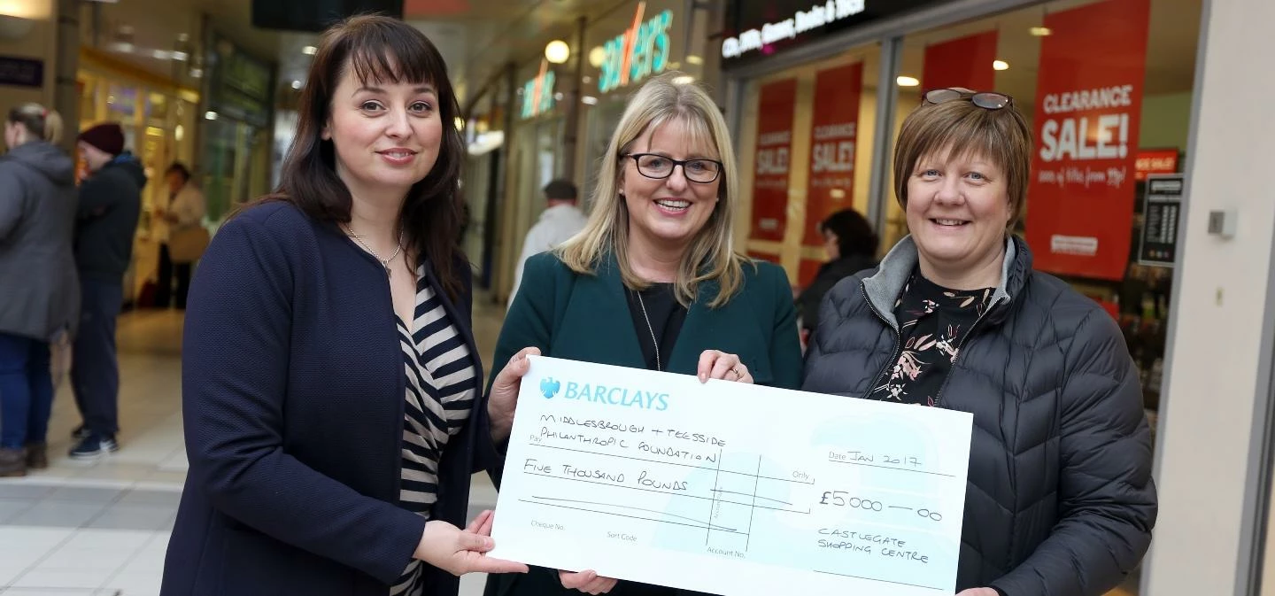 Acting Centre Manager, Tracey Surtees (L) handing over £5000 cheque to Teesside Philanthropic Founda