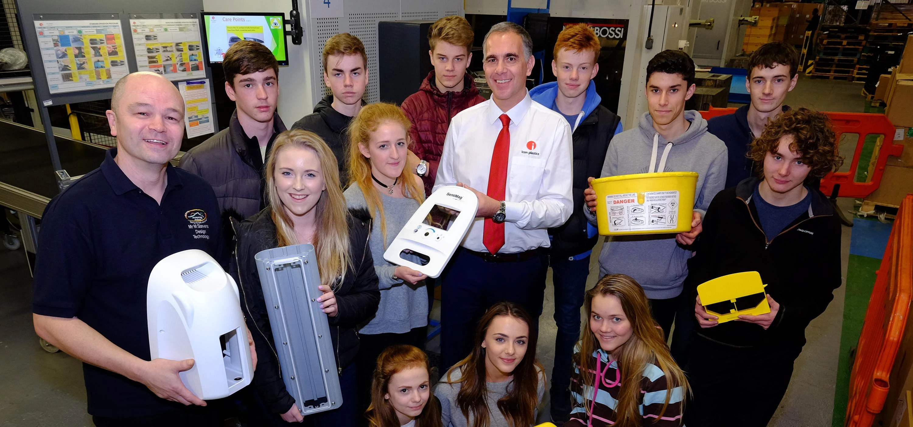 Teacher Mike Stevens, left, and Icon Plastics Operations Director Phil Walker, centre, with students