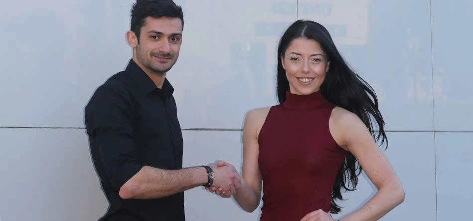 Constantinos, Student/Bartender, & Jodie, Senior Assistant General Manager Shark Club, Shaking Hands