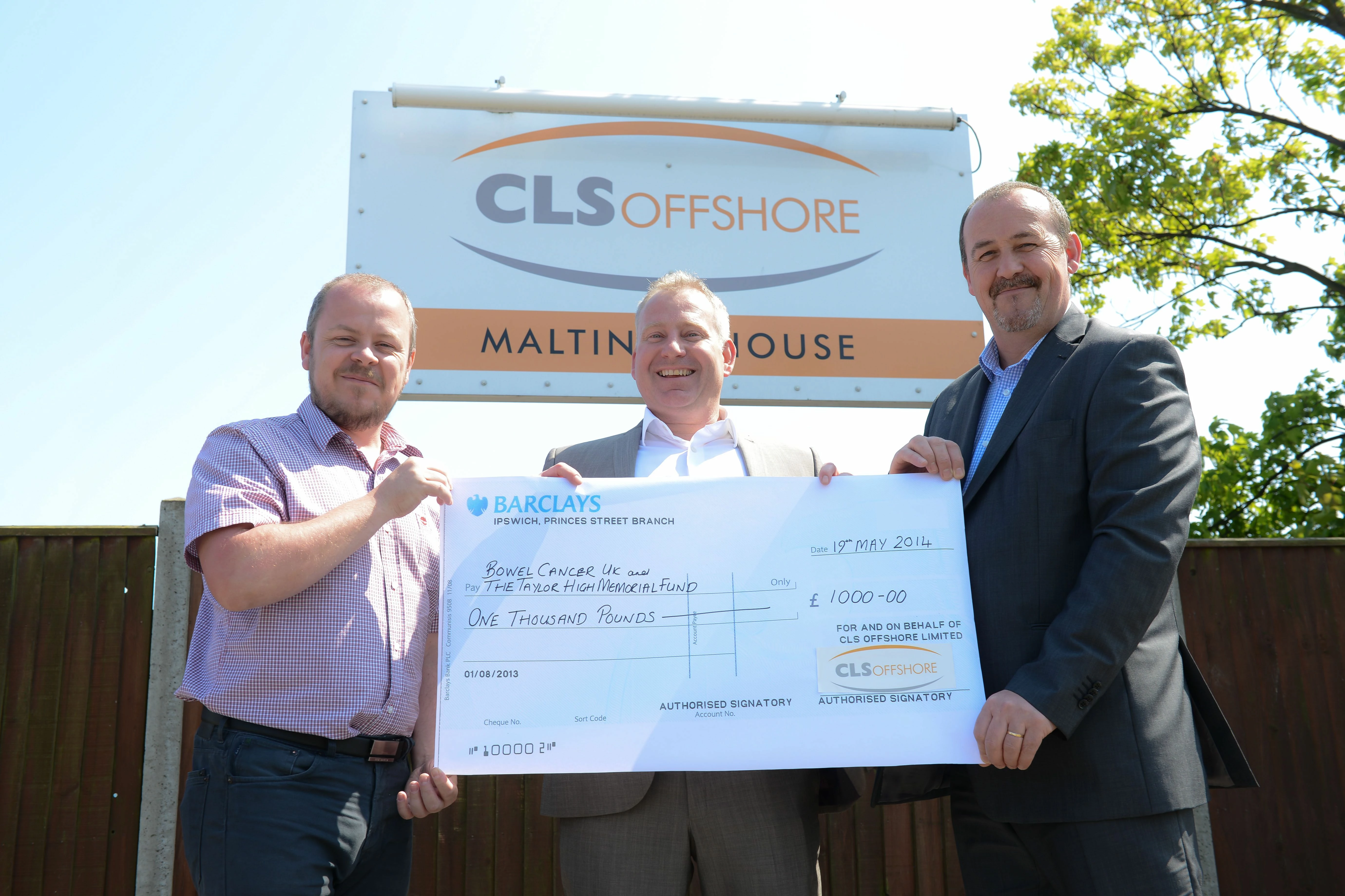 Scott McMillan and Simon Thorne present Tony Daines with a donation towards completing the challenge