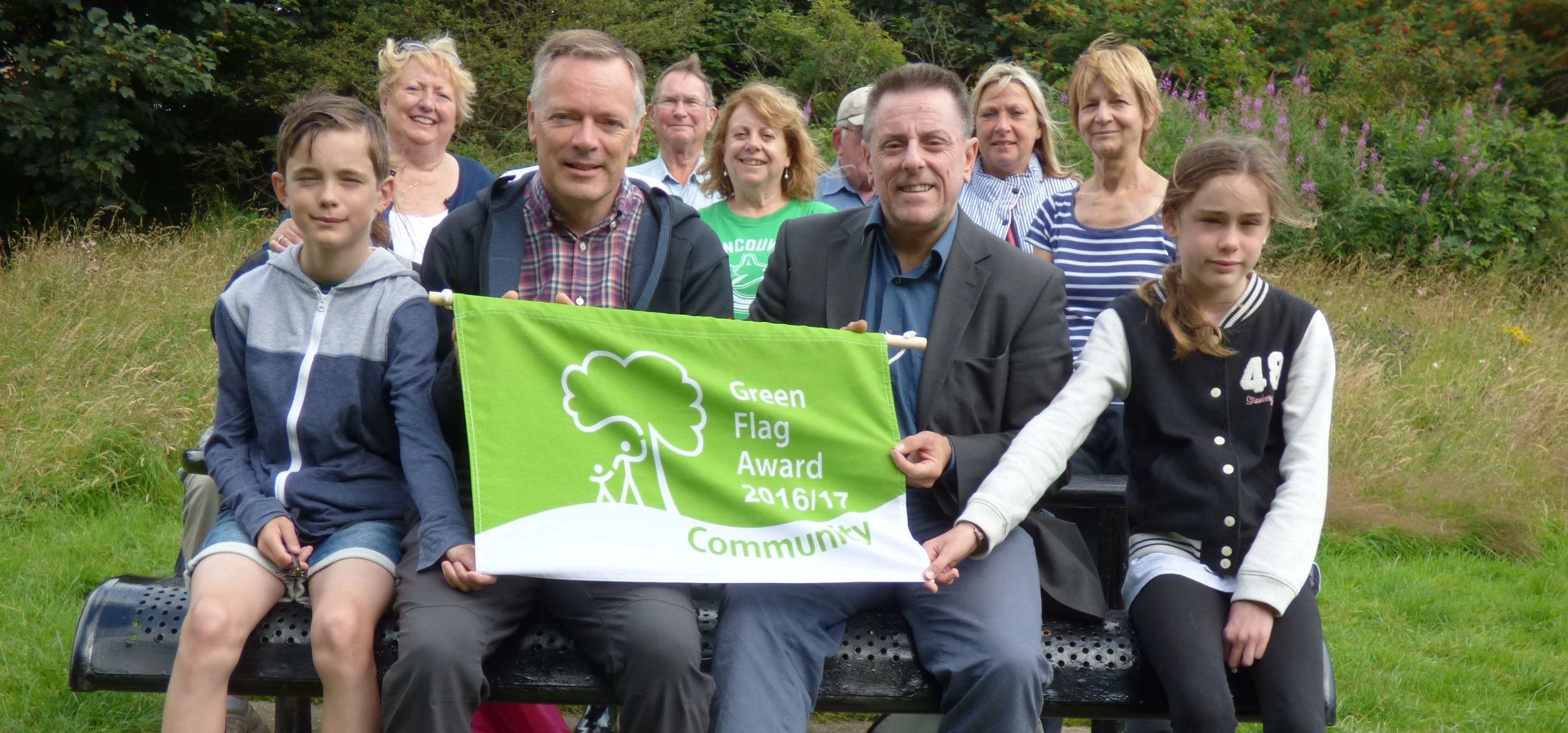 Steve Stone (second left) and the Friends of Brierdene receiving the new Green Flag Award from Mike 